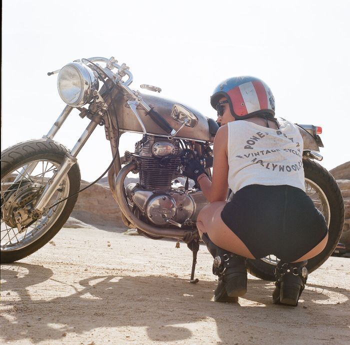 A playful frame from Girls on a motorcycle — online in Los Angeles